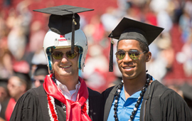 Former football teammates Josh Nunes and Jemari Roberts at graduation ceremony