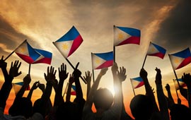 Filipinos waving national flag 