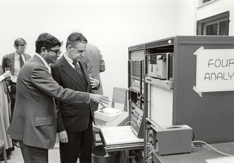 Haresh Shah showing Dr. Blume the Fourier Analyzer at the Blume Center Opening, 1974
