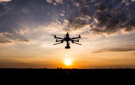 drone silhouette against the sun