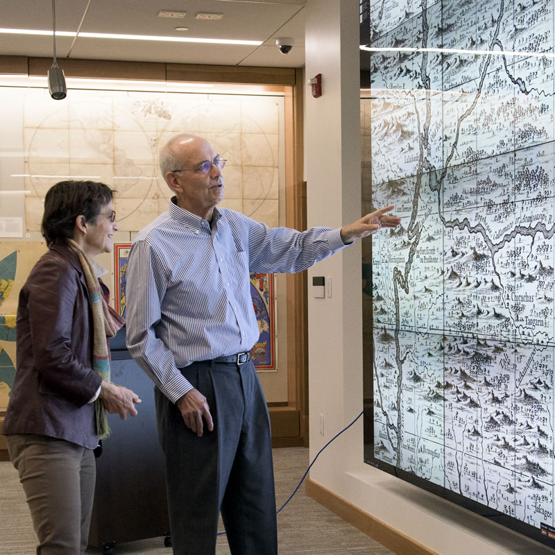 Becky Fischbach talks with David Rumsey discussing a large wall map