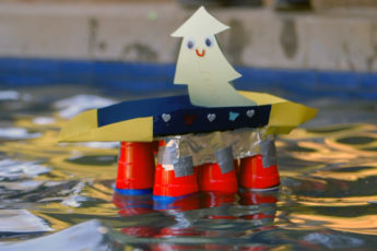 Smiling Tree sits atop boat build by Leland Scholars.