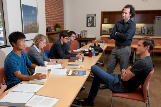7/2/2012 Stanford Summer Humanities Institute (SSHI). Ryan Lee, Abby Coleman, Sean Watson, and John Pitre participate in a small group discussion with associate professor of French and Italian Dan Edelstein (standing) and resident counselor Nathan Lindborg.