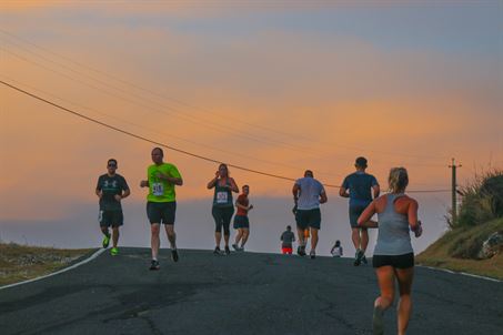 Joint Task Force Guantanamo and U.S. Naval Station Guantanamo Bay, Cuba Troopers and residents top the hill at Cable Beach as the sun rises during the Cable Beach Run July 15, 2017, here. The 10-kilometer run took the participants from the Downtown Lyceum to Cable Beach and back.