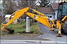 Mohawks take out border marker with a backhoe