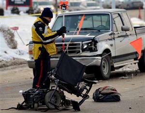 Edmonton Police Service Sgt. Brad Manz investigates a traffic accident in Mill Woods. A man in a wheelchair was struck by a truck and killed.