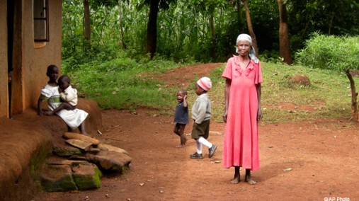 A woman and her grandchildren outside her home near Rabuor, Kenya, June 2008. [AP File Photo]