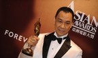 China's Wang Xueqi holds his best actor award at the 4th annual Asian Film Awards presentation ceremony at the Hong Kong Convention and Exhibition Centre on March 22, 2010. Started in 2007, the Asian Film Awards (AFA) honours fimmakers with outstanding achievements in the field of Asian cinema.