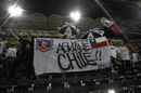 Soccer fans hold up a sign that reads &quot;Hang in there Chile,&quot; ...