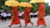 Cambodian Buddhist monks walk by the crowd, file photo. 