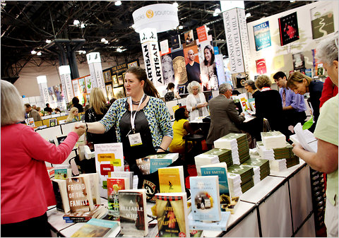 Kelly Bowen of Algonquin Books greets the public at BookExpo America at the Javits Center.