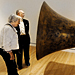 Walter and Jackie Walker examine a work by John Baldessari at the new Crystal Bridges Museum of American Art.