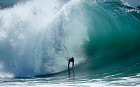 A swimmer catches a wave at The Wedge in Newport Beach, California