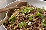 Quinoa and red rice salad with spicy cauliflower and black lentils.