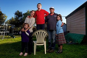 The Arbuthnot family will be one of the first families to receive the Disability Care Scheme. From left to right is Lucy 4yrs Alan, Jacob 9 yrs who has a disability, Wayne and Gemma 10. Photographed in their backyard Albans Park.