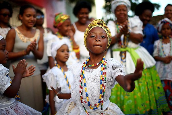 Young performers gather and dance during the Festival of the Good Death in Cachoeira, Brazil.