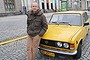 Afraid of Russia: Warsaw tour guide Marek Sidorenko with the old car that he uses for the tours.