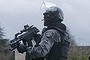 Hunting for terror suspects: Member of the French GIPN intervention police force secure a neighbourhood in Corcy, north-east of Paris. It sits next to the town of Longpont, which has been surrounded by police, according to reports.