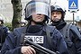 French SWAT police surround the supermarket in east Paris before the assault.