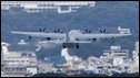 A US military cargo plane takes off from Marine Corps Air Station Futenma in Ginowan, Okinawa, Japan - 17 December 2009