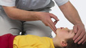 First aid (Man gives a boy first aid)