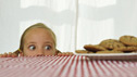 Nutrition (A girl looking at a plate of biscuits)