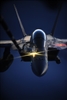 A U.S. Navy F/A-18 Hornet aircraft receives fuel from a U.S. Air Force KC-10A Extender aircraft.