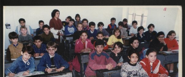 Fifth grade (second row, middle desk, looking away from camera).