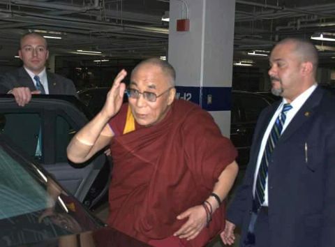 Date: 02/18/2010 Location: Washington, D.C. Description: Two DS special agents with His Holiness the Dalai Lama prepare to enter a DS vehicle at the Department of State in Washington, D.C. after his meeting with U.S. Secretary of State Hillary Clinton, February 18, 2010. Diplomatic Security provides protection for the Dalai Lama on all his visits to the United States.  (U.S. Department of State photo) - State Dept Image