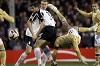 Trezeguet of Juventus attempts a shot on goal past Hughes of Fulham during their Europa League last 16, second leg soccer match at Craven Cottage in London
