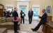 President Barack Obama Talks with Advisors in the Oval Office