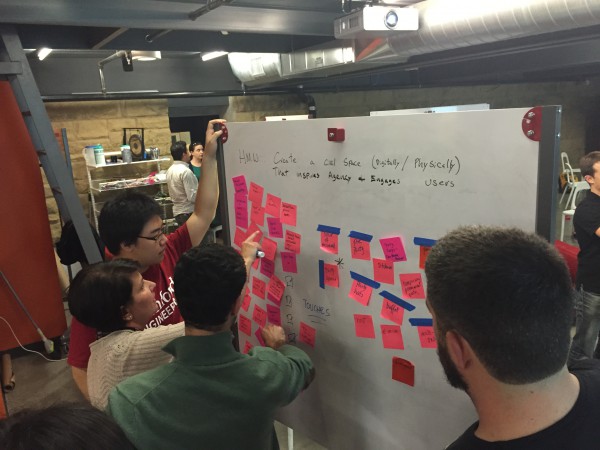 A team populates a whiteboard with new ideas during class three of "Redesigning the News Ecosystem."