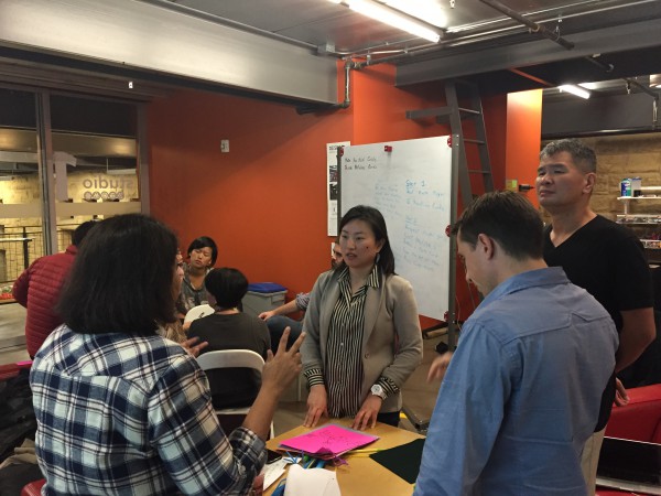 Jae Rhim Lee, a d.school fellow, artist and former TED fellow, tests prototypes with students. (Emi Kolawole)