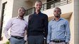 Ayodeji Adewunmi, Olalekan Olude and Opeyemi Awoyemi standing outside in business attire