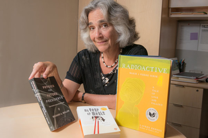 Persis Drell with Three Books for frosh / L.A. Cicero