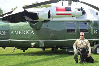 Deputy Adam Cullen with K-9 Red in front of presidential helicopter / SUDPS