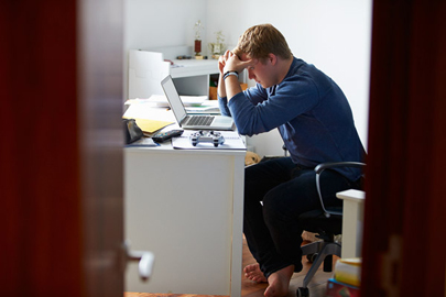 boy overwhelmed with homework / Monkey Business Images/Shutterstock