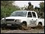 A convoy of the United Nations Assistance Mission in Darfur (UNAMID) crosses through a mud track in the southern village of Kashalongo, South of the city of Nyala, in southern Darfur on June 18, 2009. 