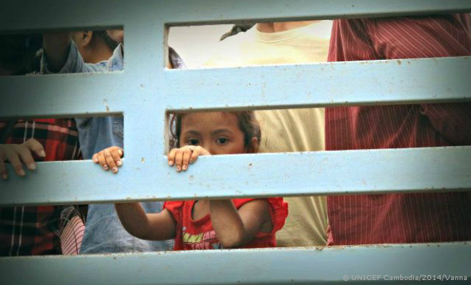 A young girl in transit at the Thai-Cambodian border. 