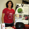 Female staffer at the Health Improvement table at a Benefits Fair