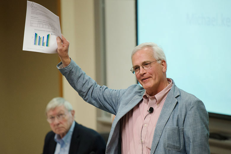 Michael Keller holding up papers / Photo: L.A. Cicero