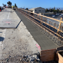 Concrete Placement in Progress for Deck and Barrier Retrofit - March 2021