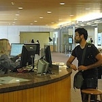 A student receiving assistance at the Information Center