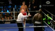 Romney, Holyfield box for charity