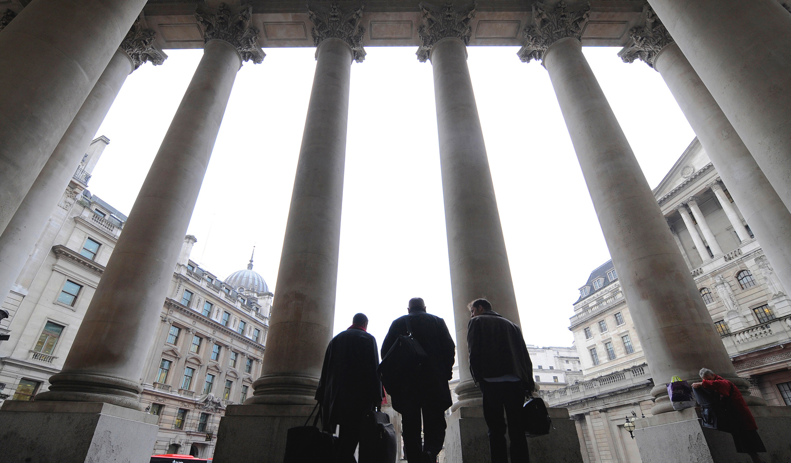 Men walking outside a bank