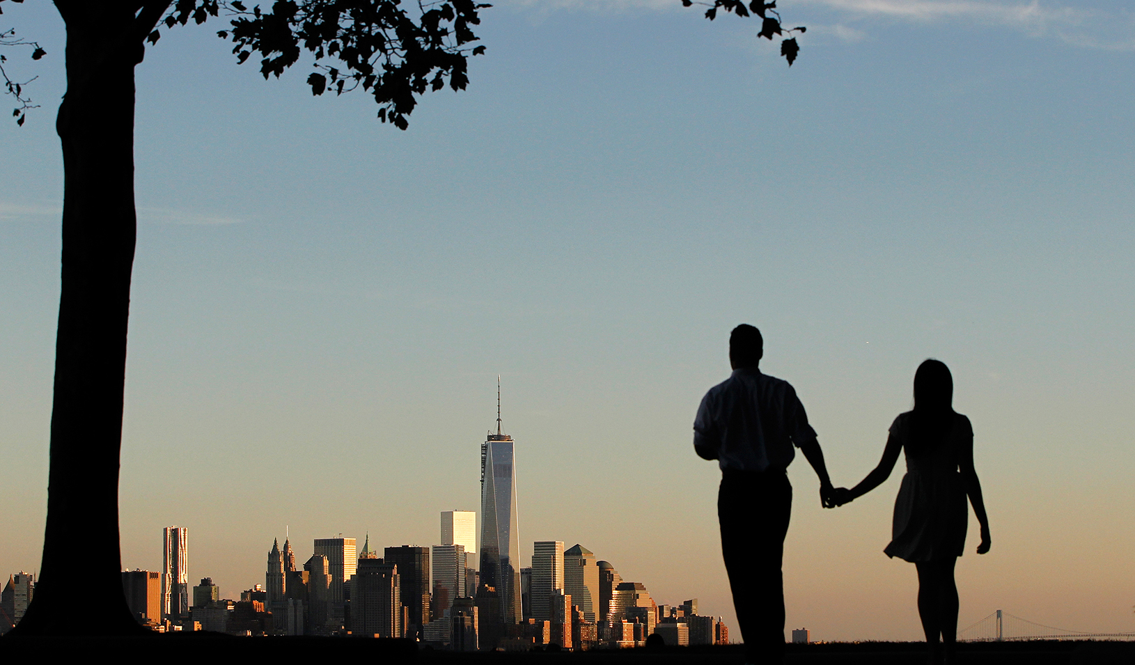 Man and woman holding hands and walking | Reuters/Gary Hershorn