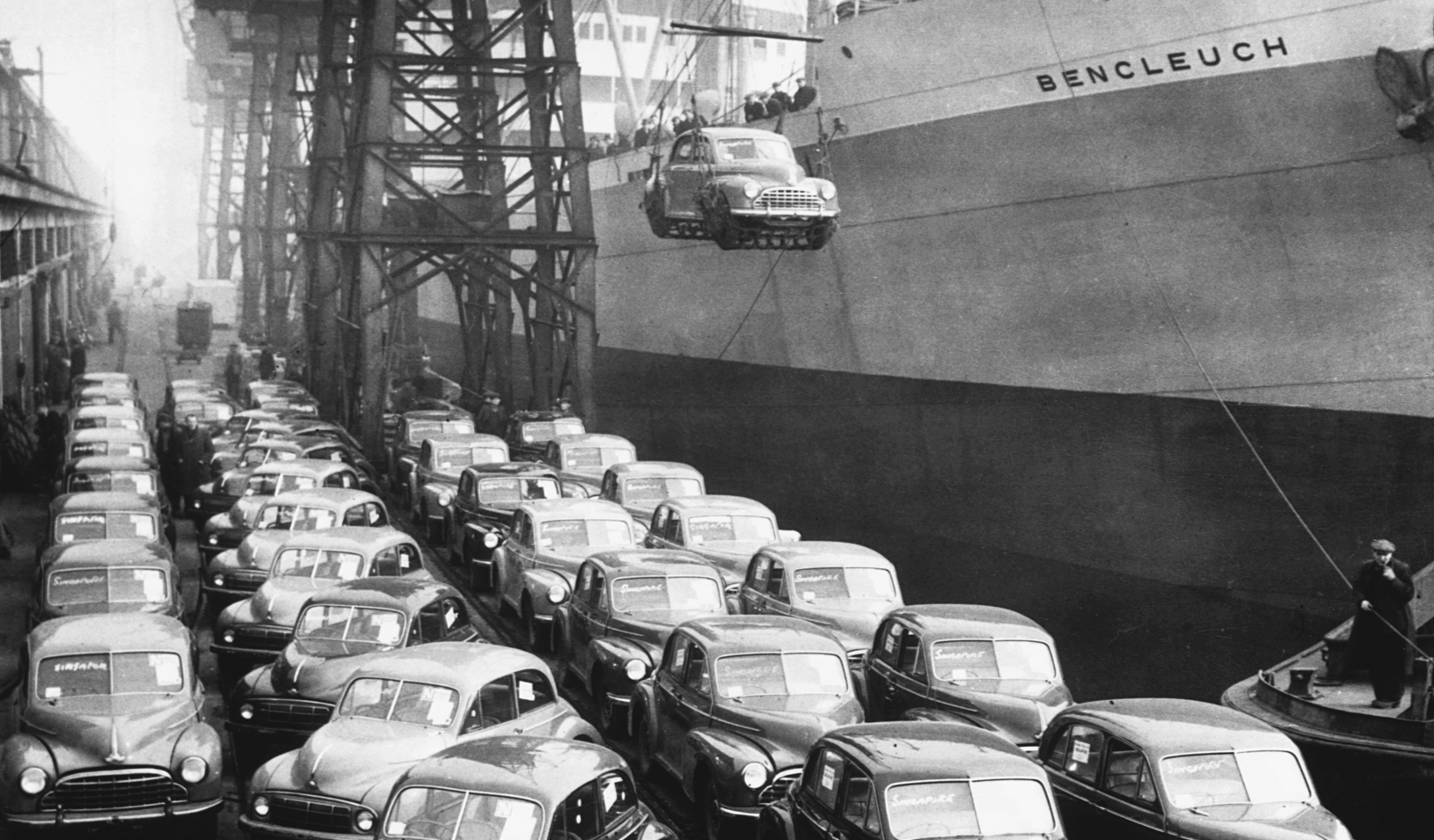 Shipping Morris Minors and Oxfords overseas from English wharf, 1949