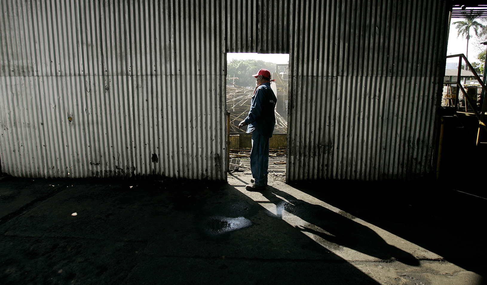 Man standing in doorway of rundown building | Reuters/Andrew Winning