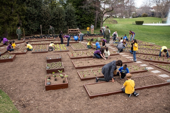 First Lady Michelle Obama joins FoodCorps leaders and local students for the spring garden planting in the White House Kitchen Garden, April 2, 2014.