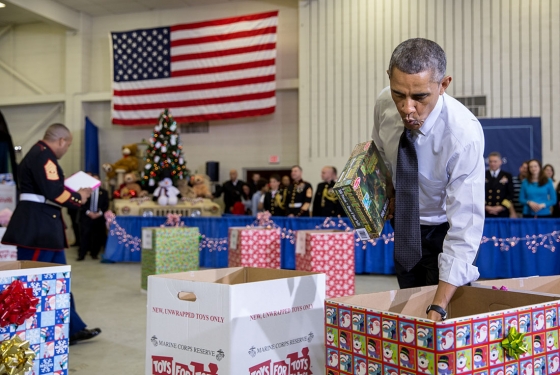 President Obama sorts toys with U.S. Marines and children at Toys for Tots event